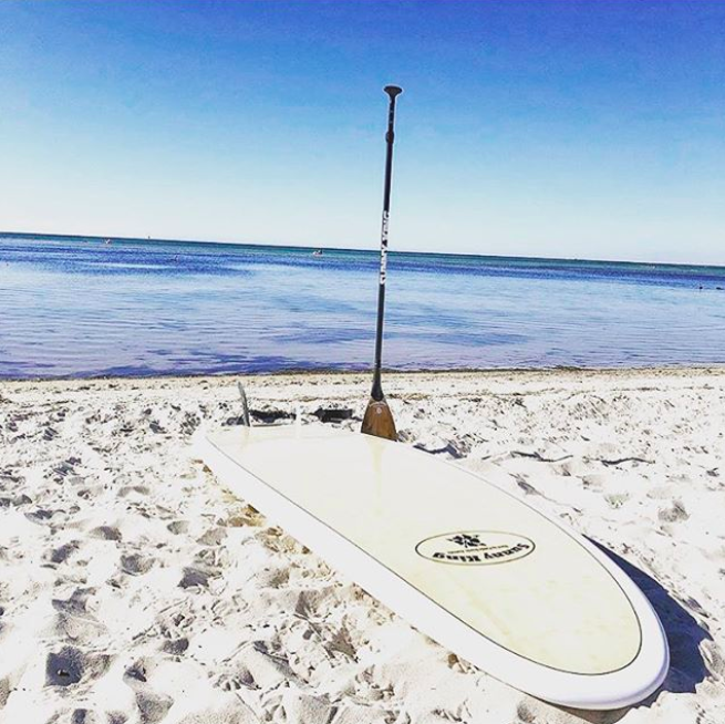 Sunny king sup isup by the sea with three family travel paddleboarding watersports